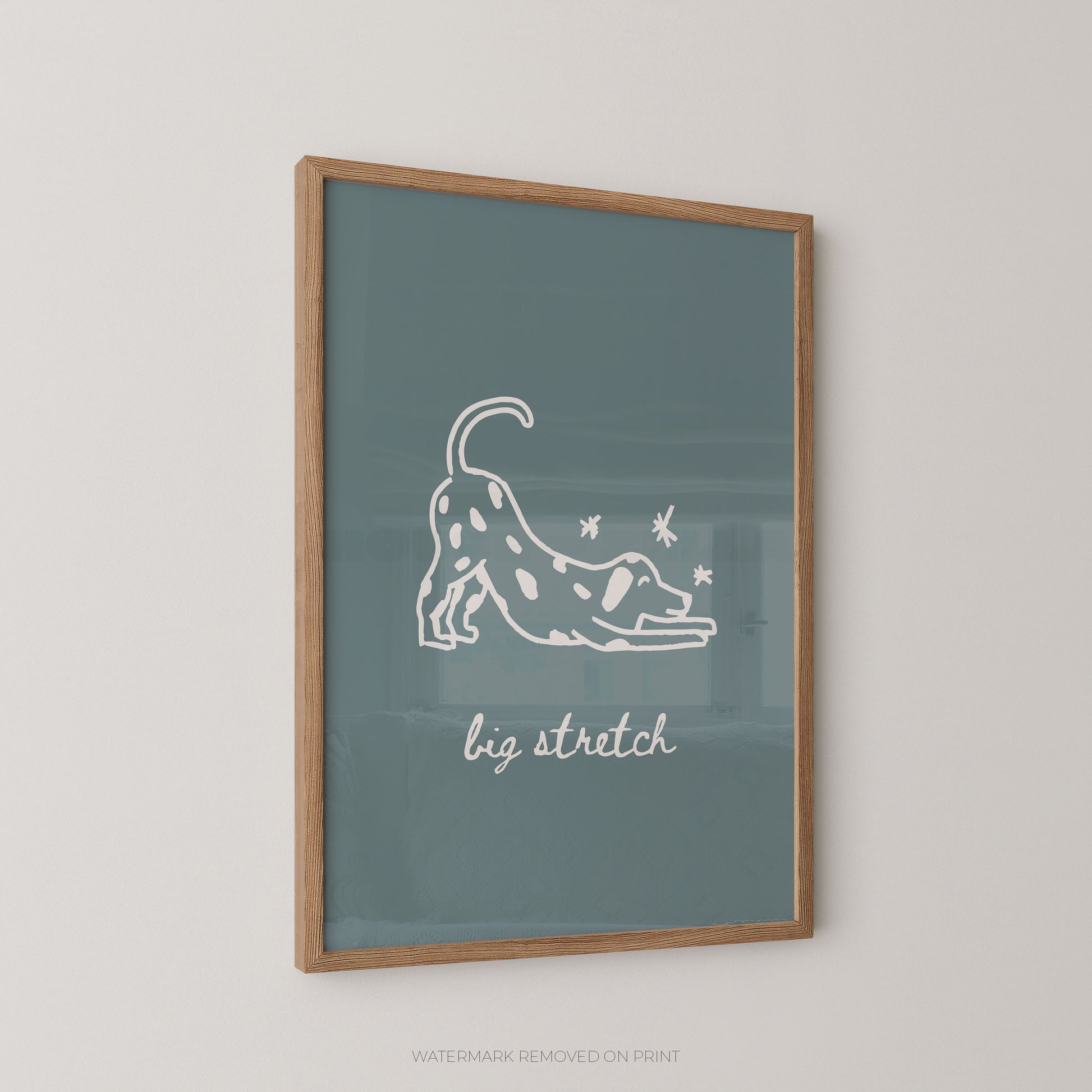 Framed artwork with a white line drawing of a dog stretching and text 'big stretch' on a teal background.