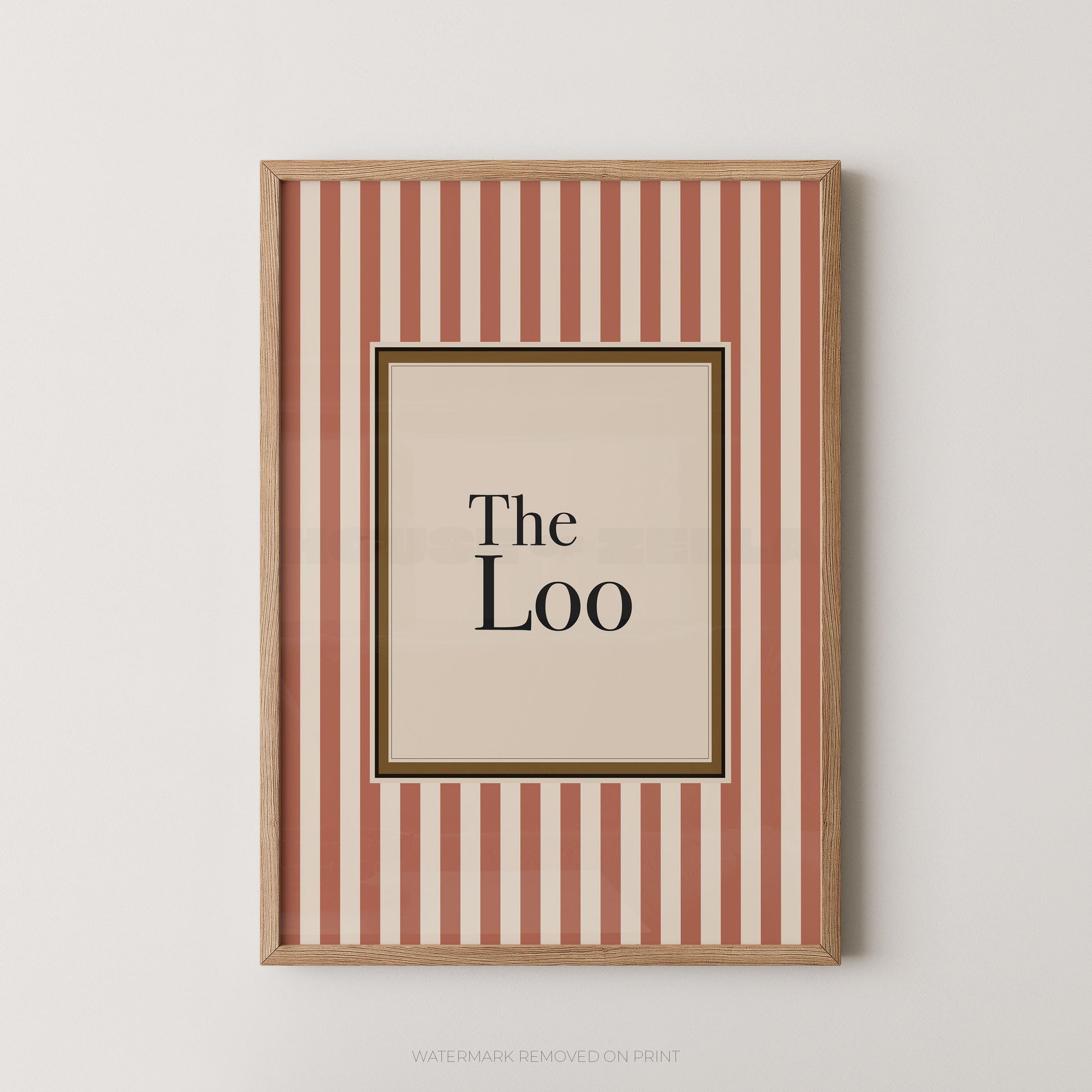 Framed artwork with 'The Loo' text on a striped background