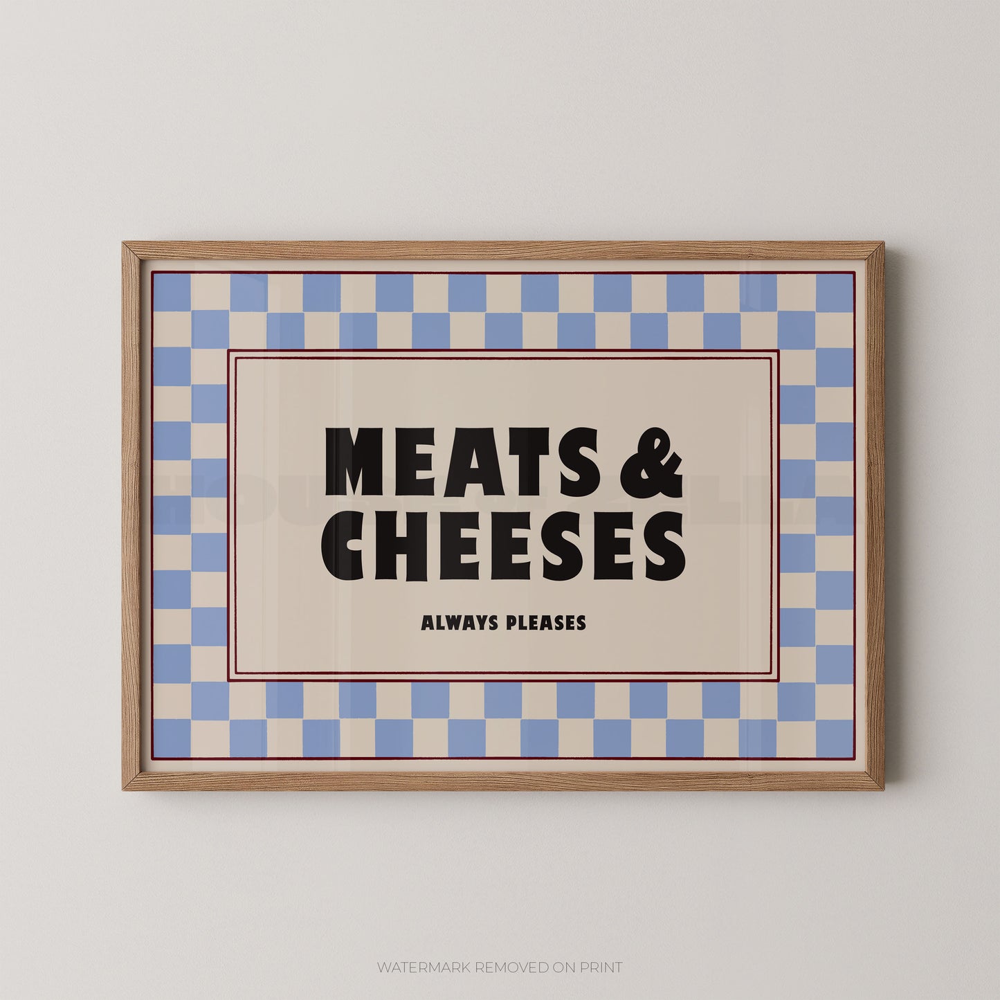 Framed sign with 'MEATS & CHEESES ALWAYS PLEASES' text on a checkered background
