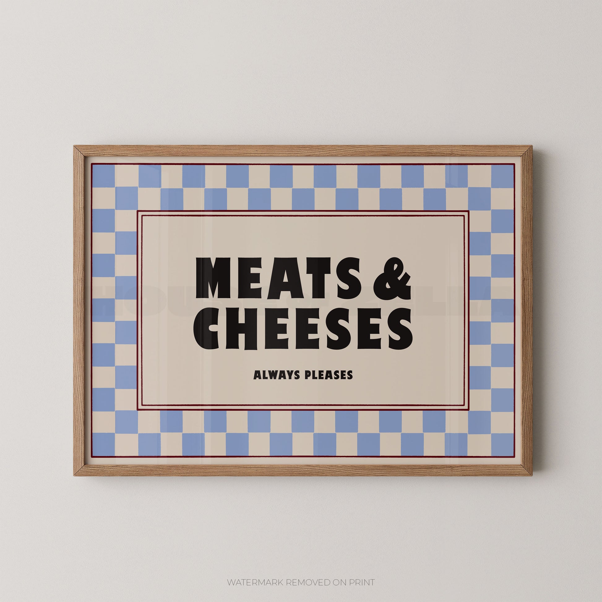 Framed sign with 'MEATS & CHEESES ALWAYS PLEASES' text on a checkered background