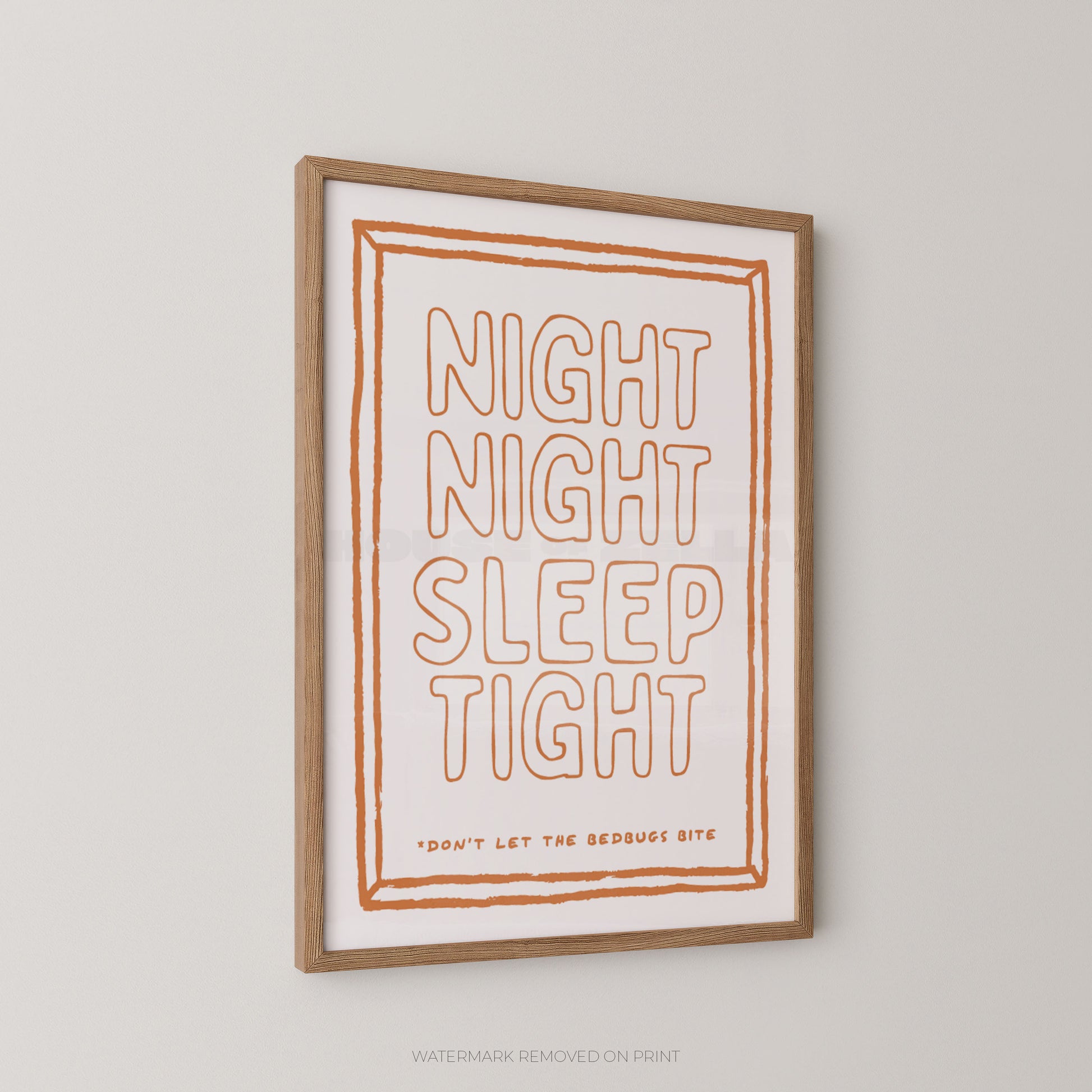 A framed typographic wall art print with the words “NIGHT NIGHT SLEEP TIGHT” in orange outlined lettering on a white background, with a light wood frame, shown hanging against a light gray wall.