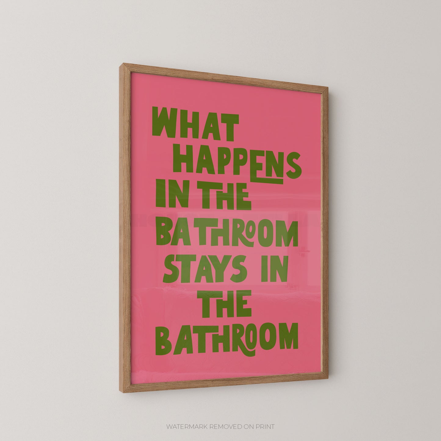 Funny bathroom wall art print – bold pink and green chunky typography on a background reading "What Happens In The Bathroom Stays In The Bathroom"