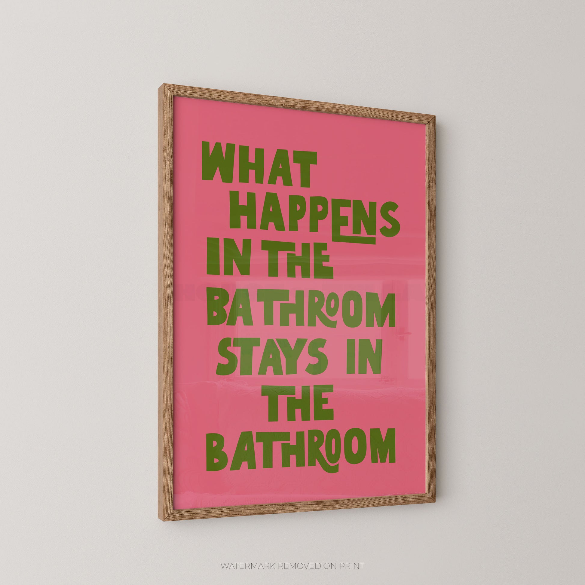Funny bathroom wall art print – bold pink and green chunky typography on a background reading "What Happens In The Bathroom Stays In The Bathroom"