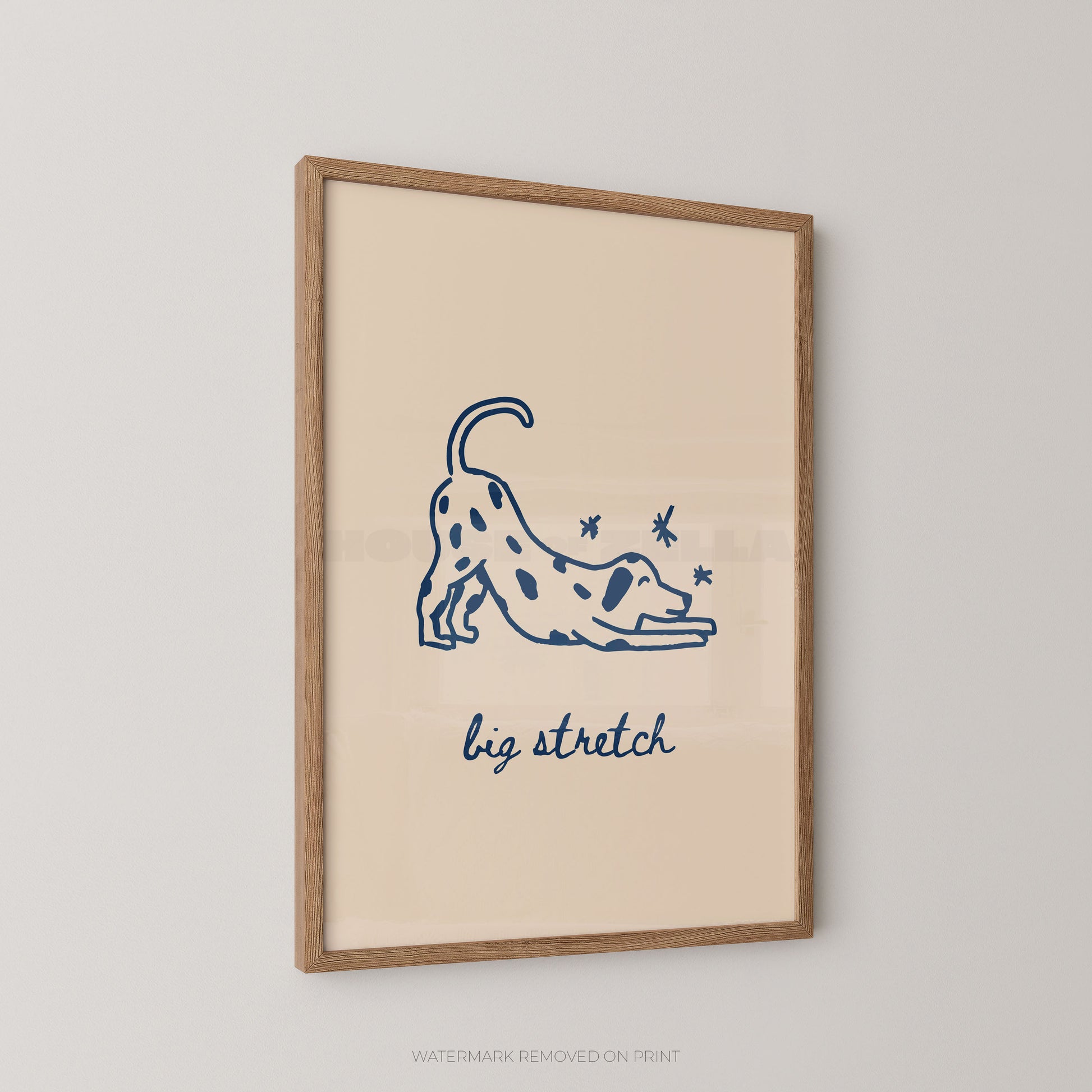 Framed artwork with a blue illustration of a dog stretching and the text 'big stretch' on a beige background.