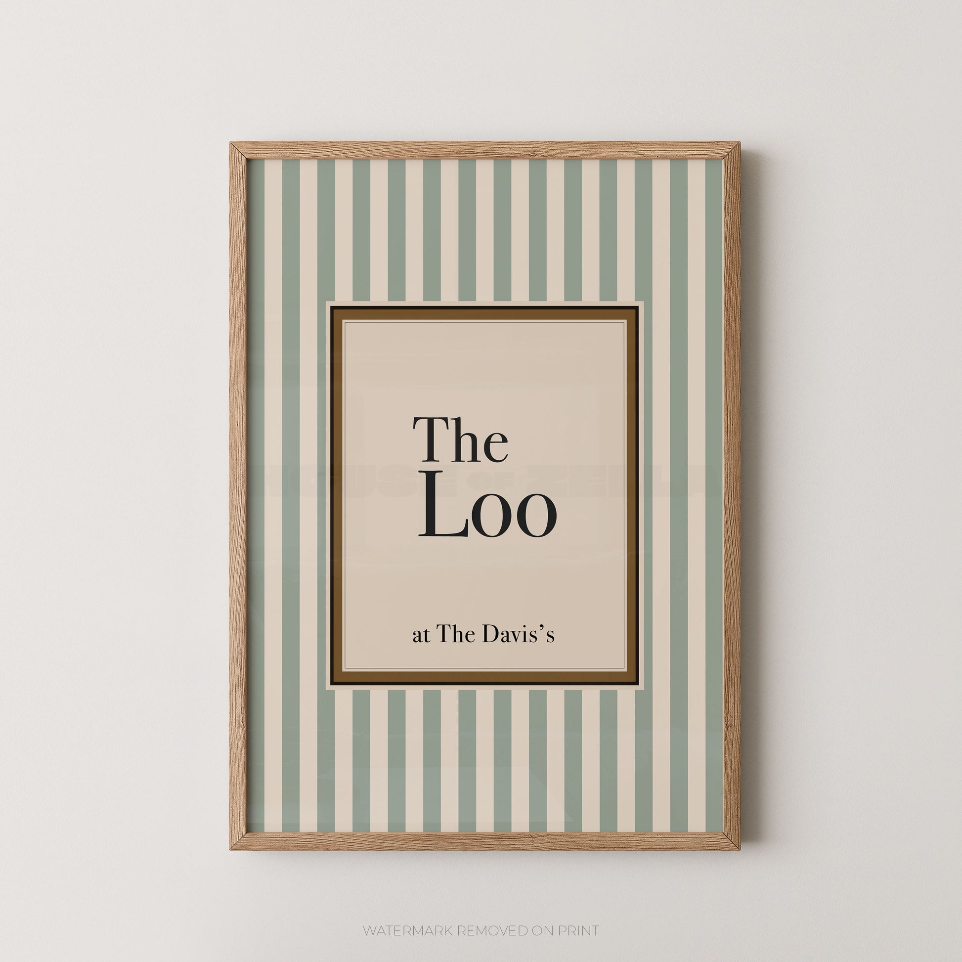 Framed artwork with 'The Loo' text on a striped background