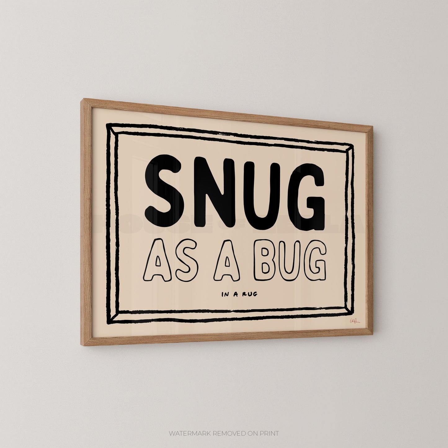 Framed print with 'SNUG AS A BUG' text on a beige background