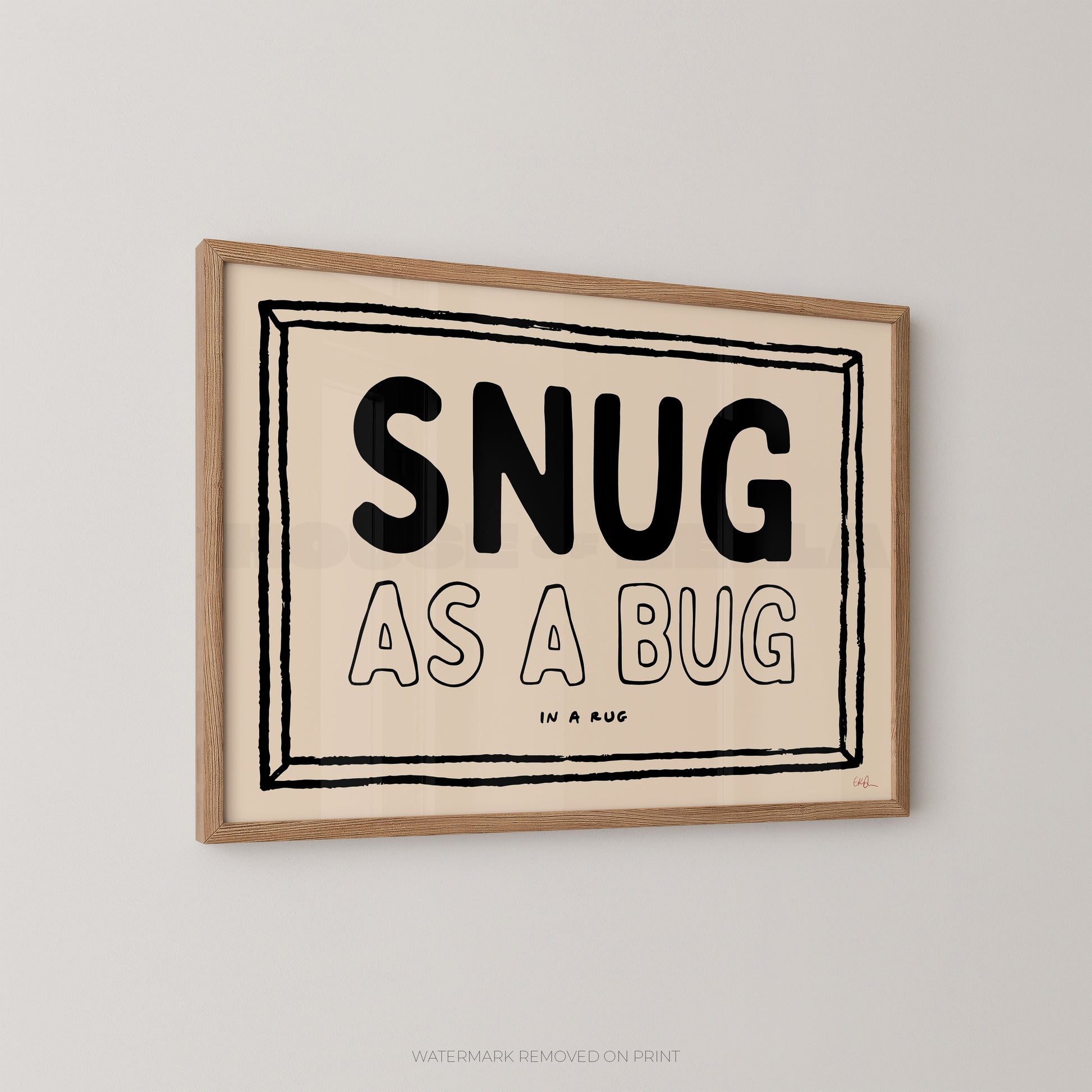 Framed print with 'SNUG AS A BUG' text on a beige background