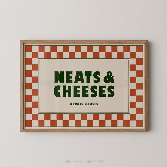 Framed sign with 'Meats & Cheeses Always Please' text on a checkered background