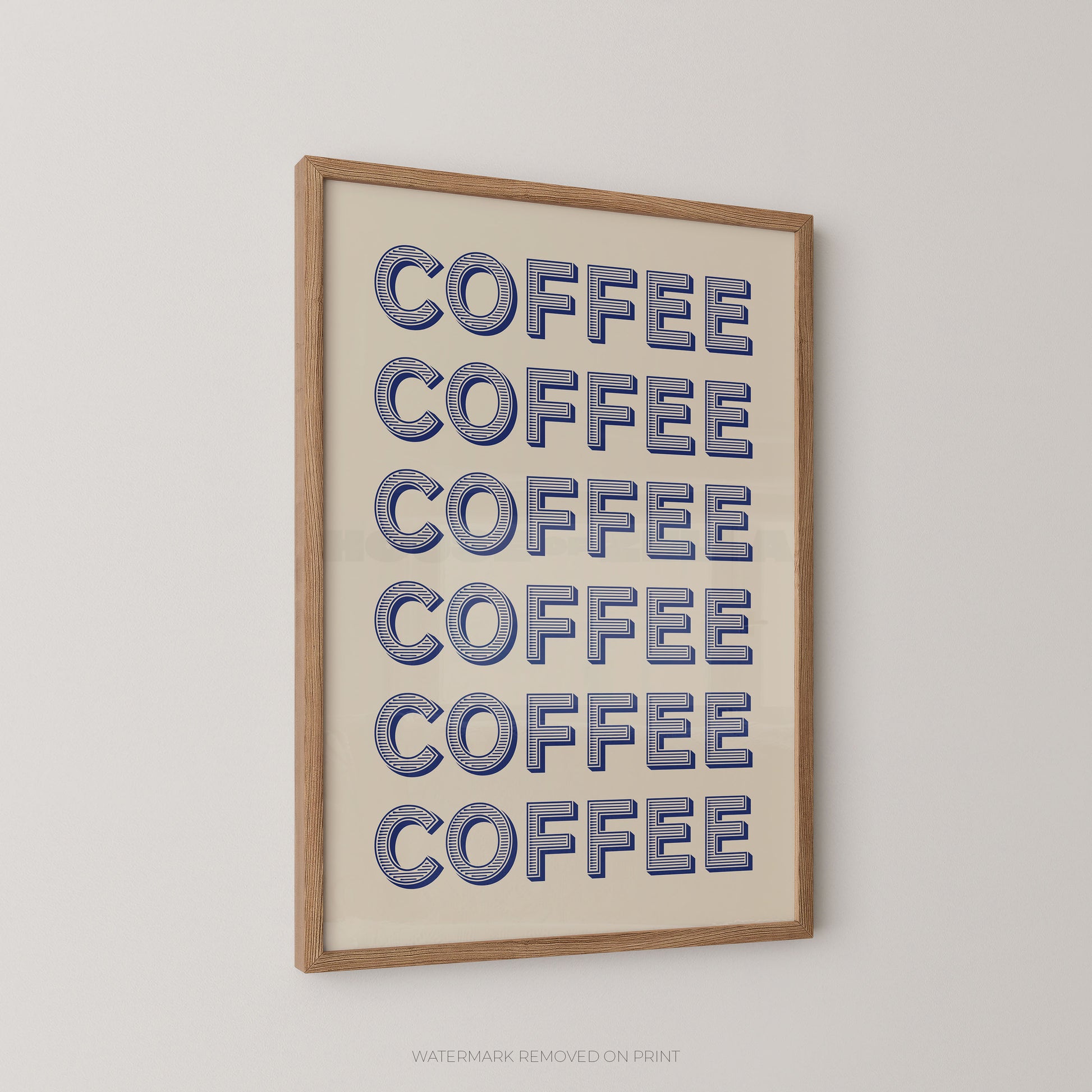 Framed wall art featuring the word 'COFFEE' repeated six times in blue outlined letters on a cream background, enclosed in a light natural wood frame and shown hanging on a light gray wall.