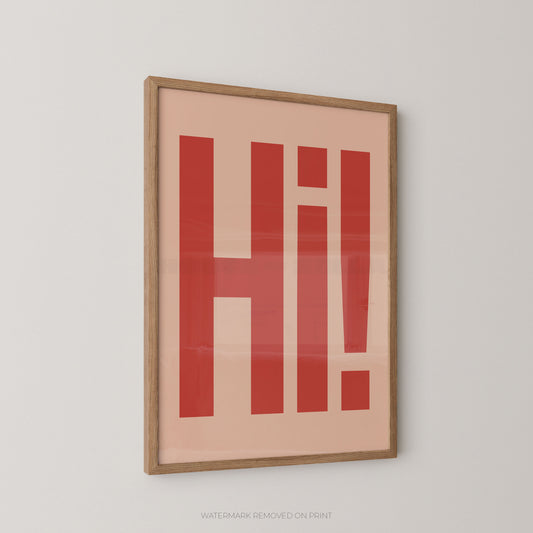Framed typographic wall art featuring the word 'Hi!' in bold red letters on a warm peach background, enclosed in a light natural wood frame and shown hanging on a light gray wall.