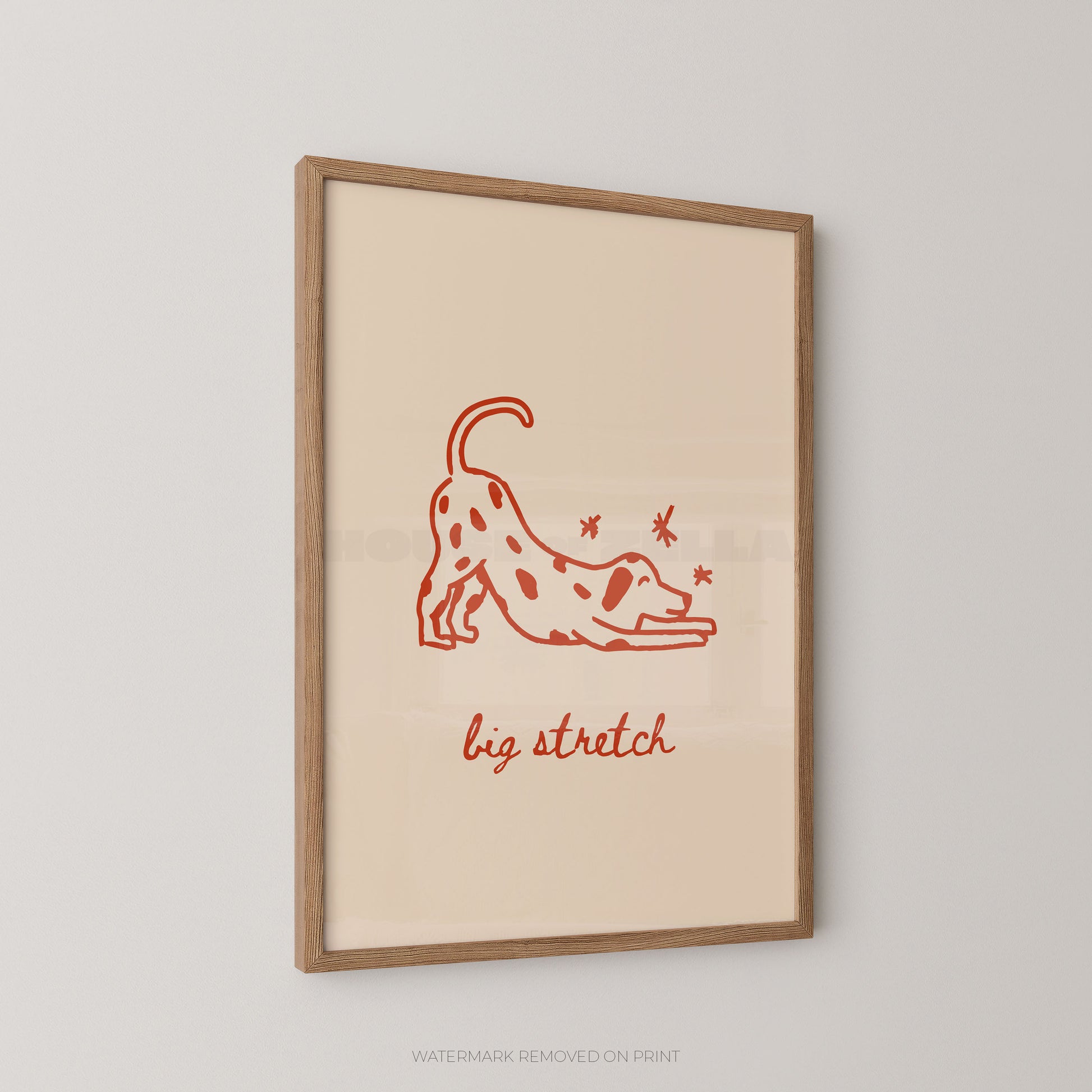 Framed artwork with a red line drawing of a dog stretching and the text 'big stretch' on a beige background.