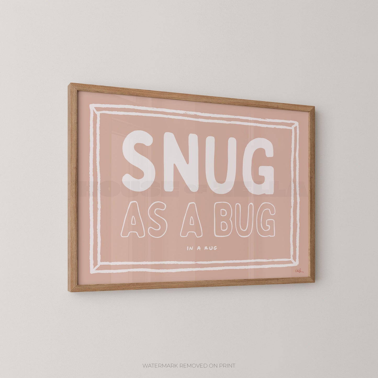 Framed print with 'SNUG AS A BUG' text on a light background
