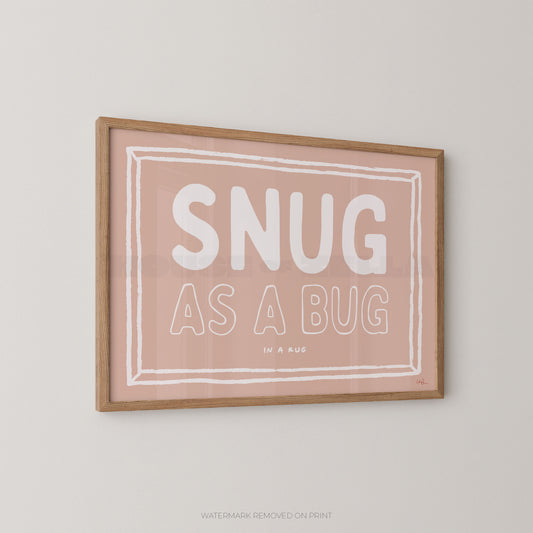Framed print with 'SNUG AS A BUG' text on a light background
