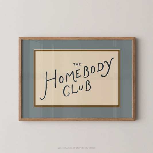Framed print with 'The Homebody Club' text on a plain background