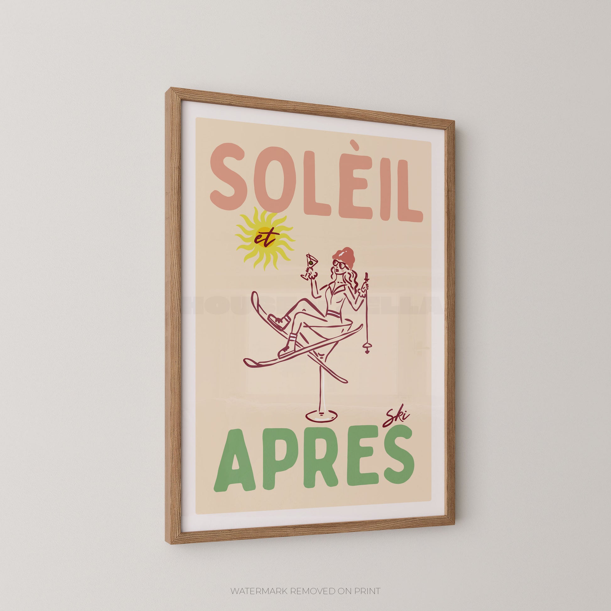 Framed retro-style poster with the French text “SOLÉIL et APRES” and a simple line drawing of a skier, shown hanging on a light gray wall.