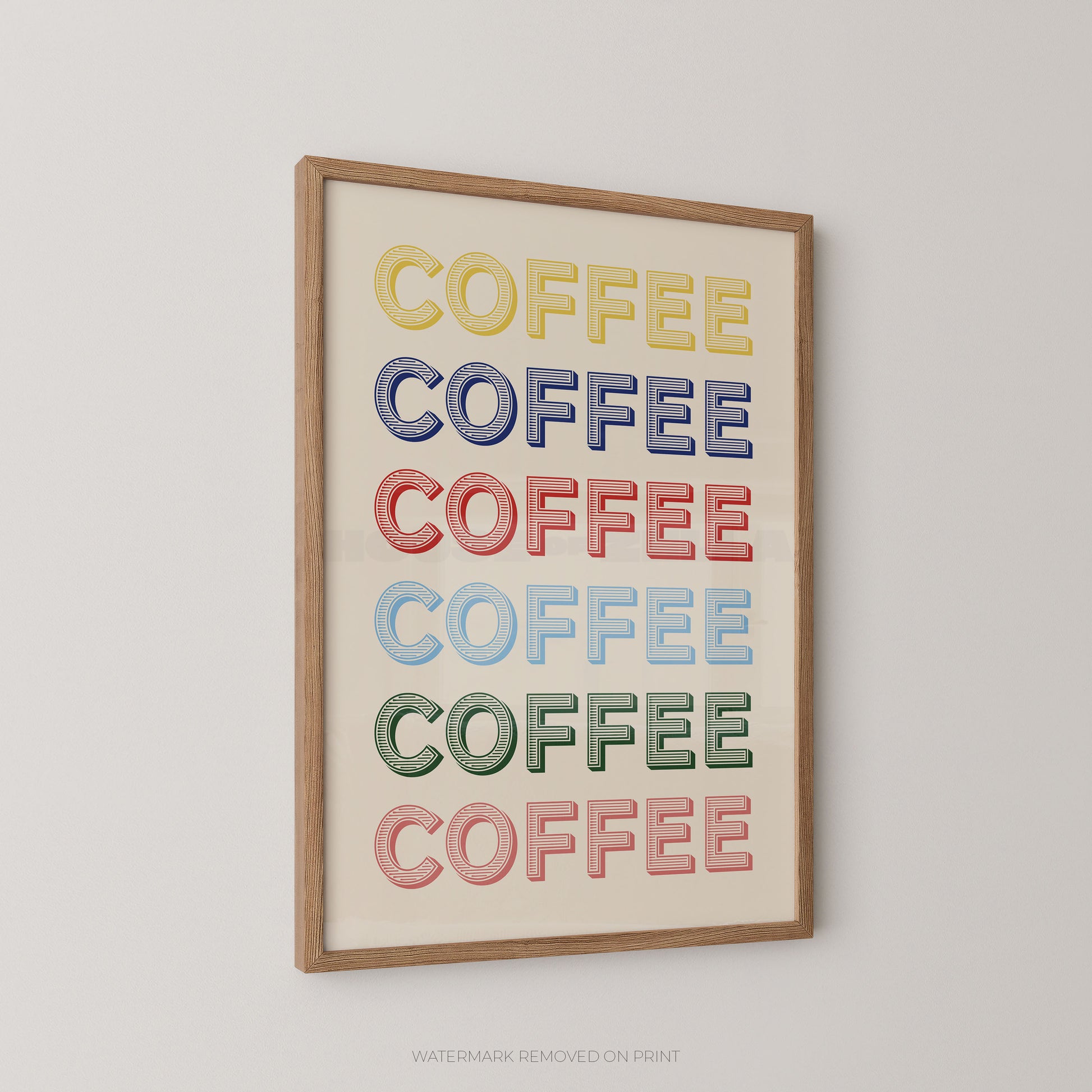 Framed wall art featuring the word 'COFFEE' repeated six times in alternating pastel colors on a cream background, shown hanging on a light gray wall.