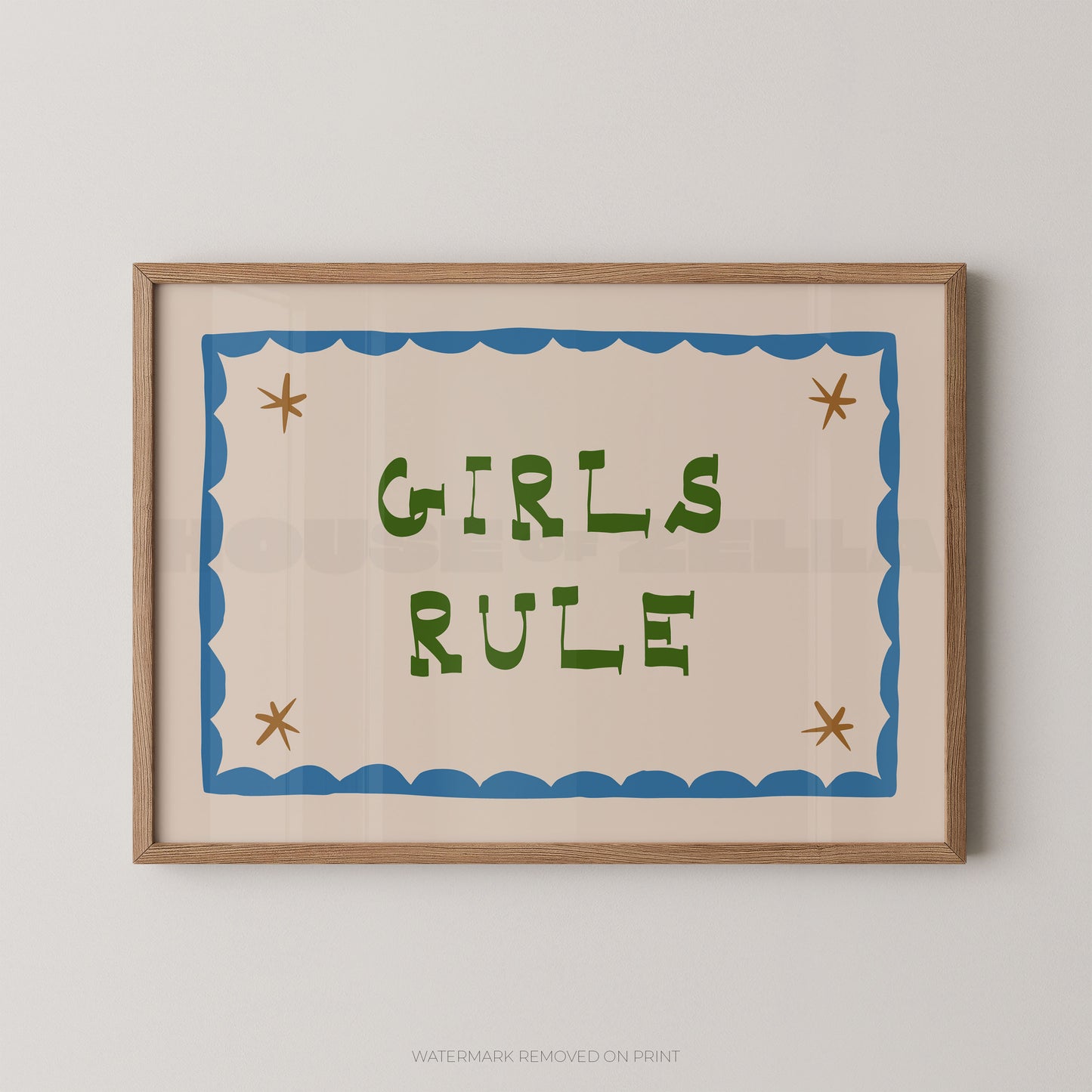 "Girls Rule children's wall art print with bold green retro lettering on a cream background, blue scallop border with gold star details, displayed straight-on in an oak frame"

