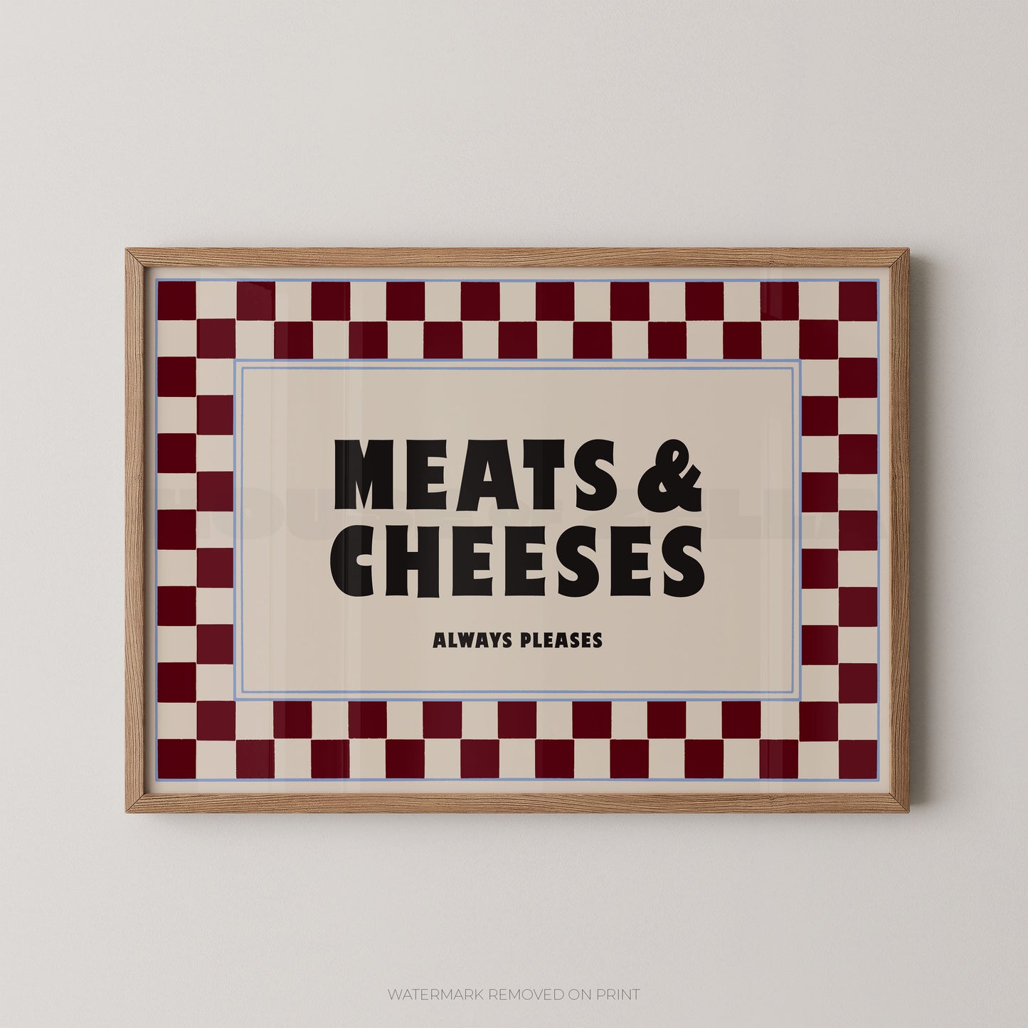 Framed sign with 'MEATS & CHEESES ALWAYS PLEASES' text on a checkered border.