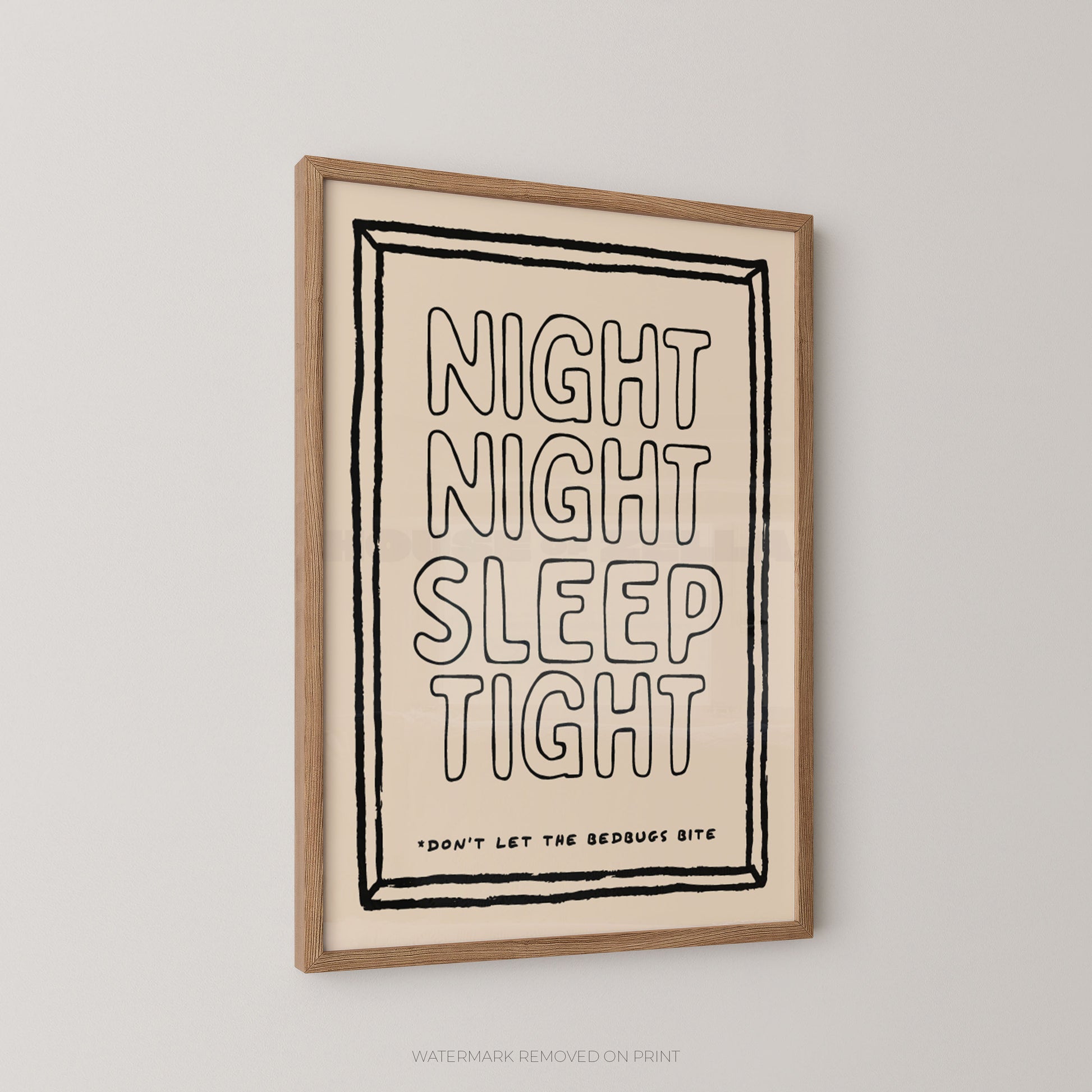 A framed typographic wall art print hanging on a light gray wall. The print has a cream background with black outlined text reading “NIGHT NIGHT SLEEP TIGHT” and smaller text near the bottom that says “DON’T LET THE BEDBUGS BITE.