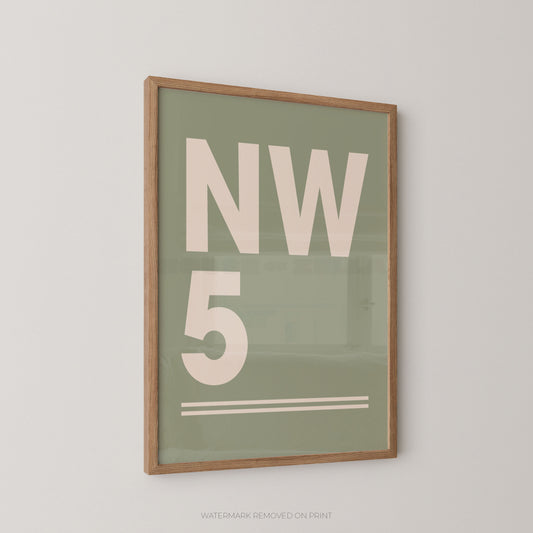 Framed minimalist wall art print with large cream lettering reading 'NW 5' on a muted sage green background, shown hanging on a light neutral wall.