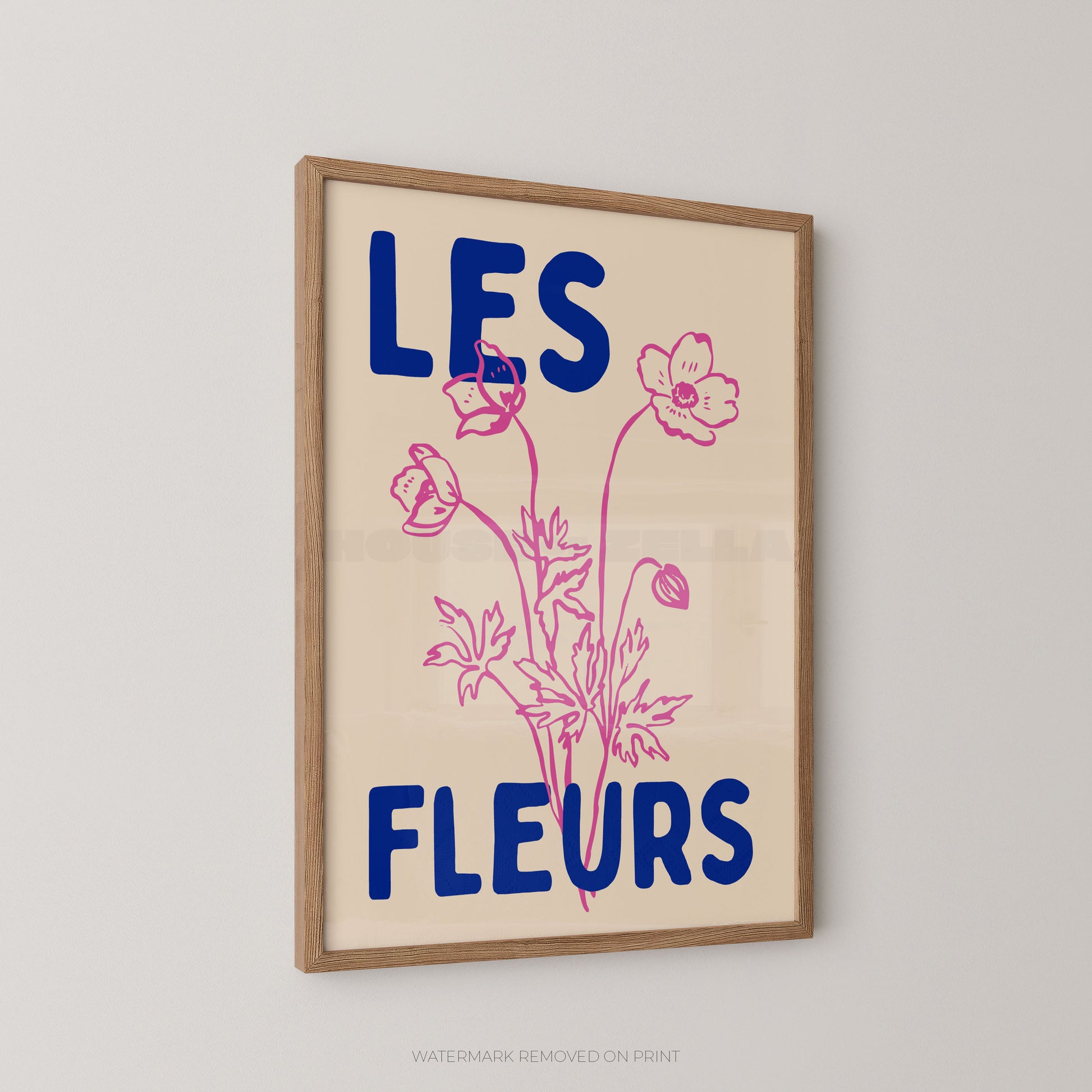 Les Fleurs botanical wall art print, cream floral poster with pink botanical illustration and bold blue typography.