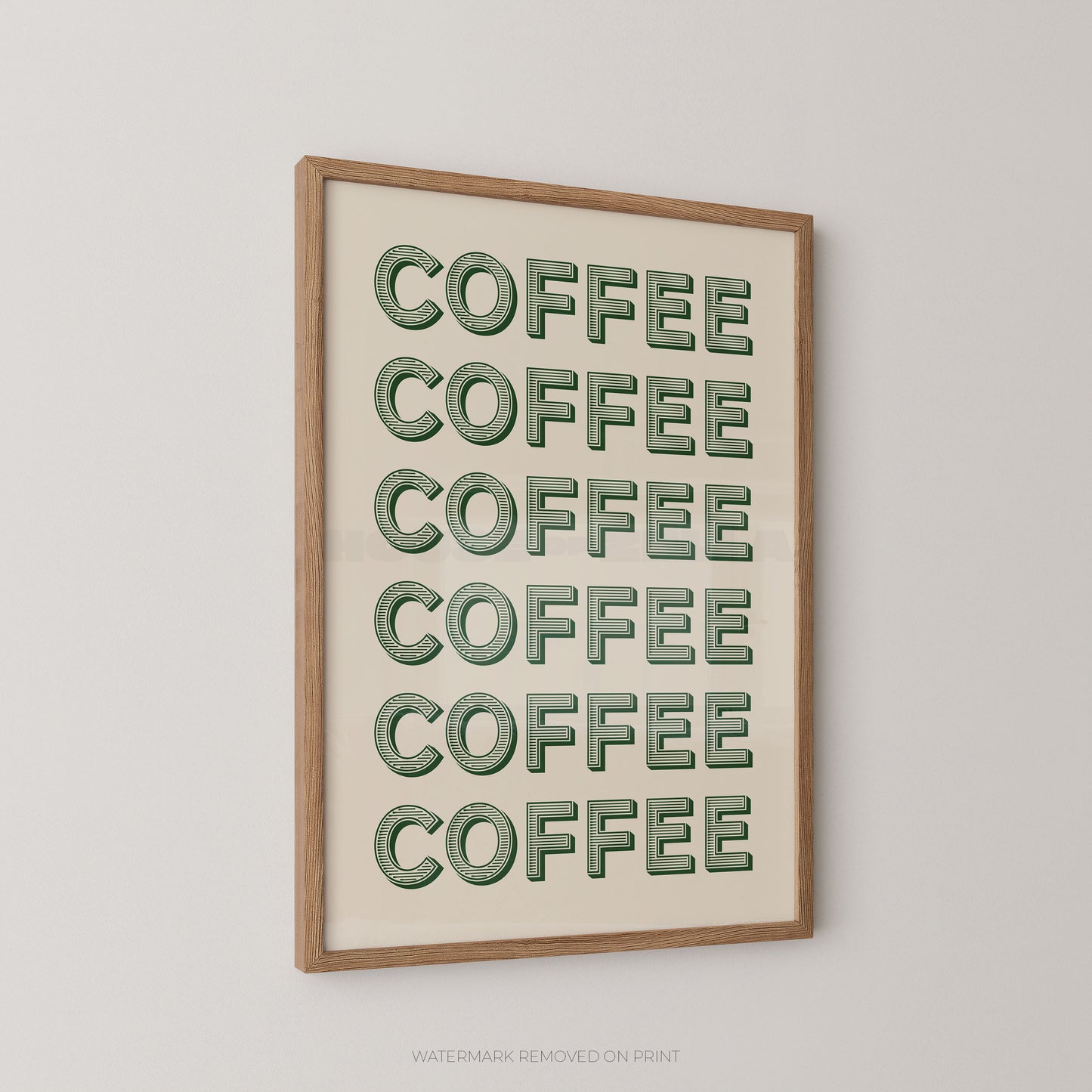 Framed wall art featuring the word 'COFFEE' repeated six times in green outlined letters on an off-white background, shown hanging on a light gray wall.