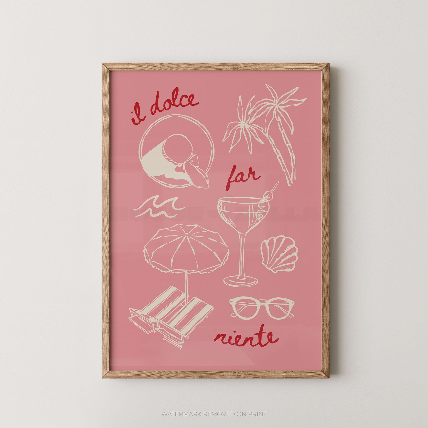 A framed art print featuring a pink background with white line drawings of beach and cocktail motifs, accented with red handwritten text in Italian. The print is housed in a light natural wood frame and is displayed against a neutral light gray wall.