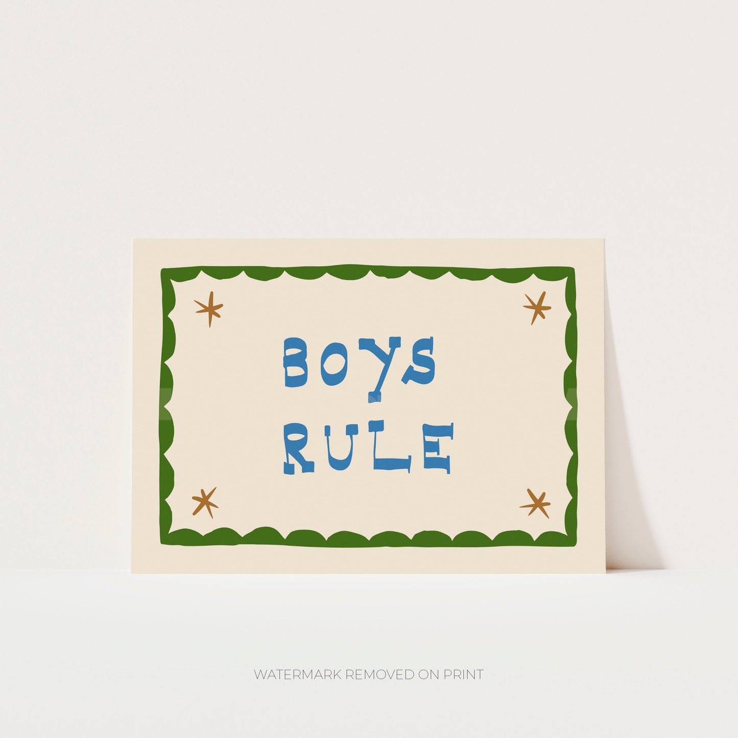 Boys Rule' art print showing blue text on a beige background, with a green decorative border and gold/beige stars in the corner.