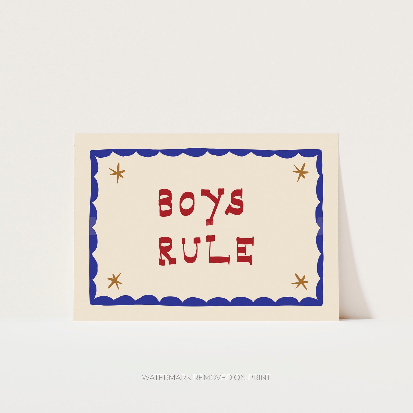 Boys Rule' art print showing red text on a beige background, with a blue decorative border and gold/beige stars in the corner.