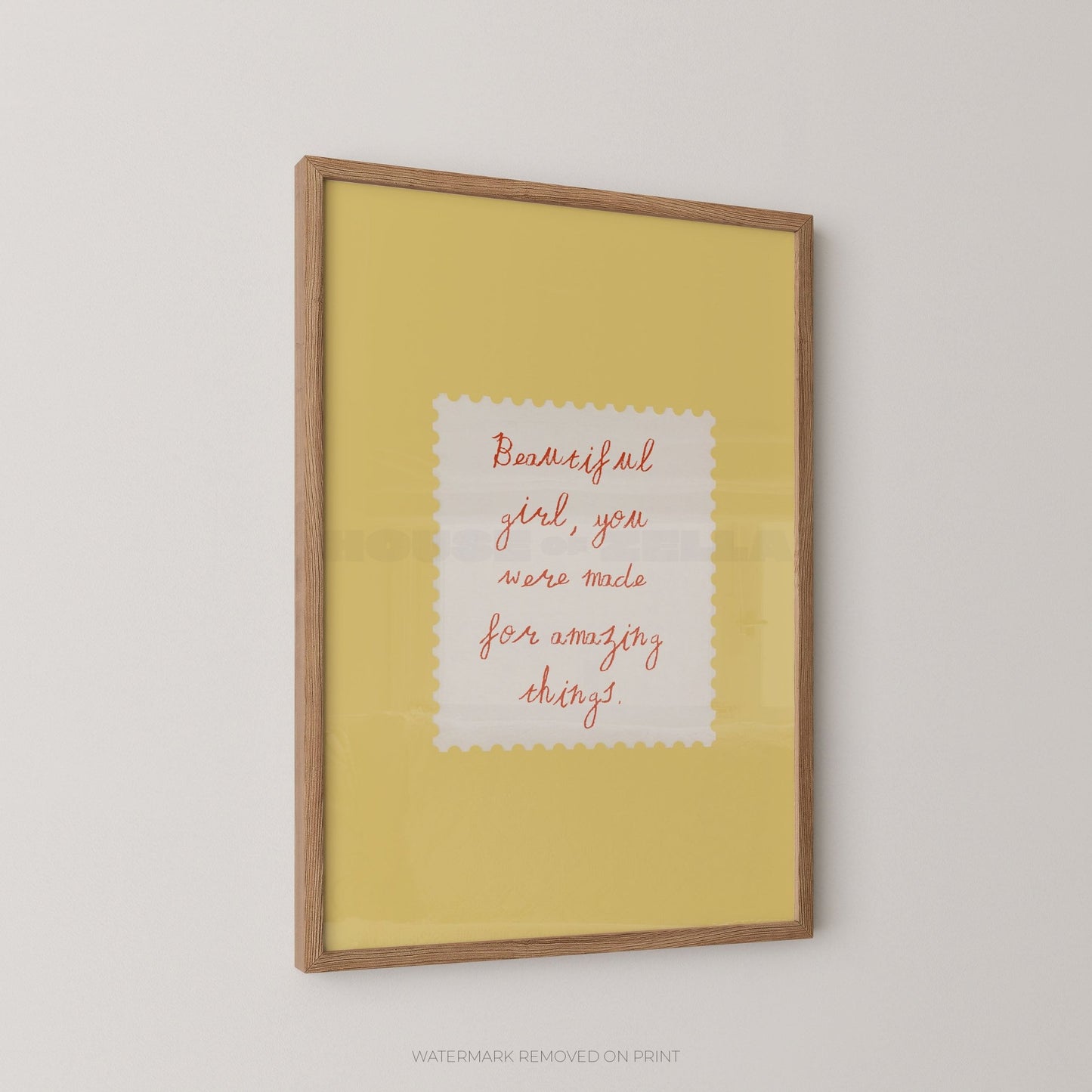 Framed print with motivational quote on a yellow background