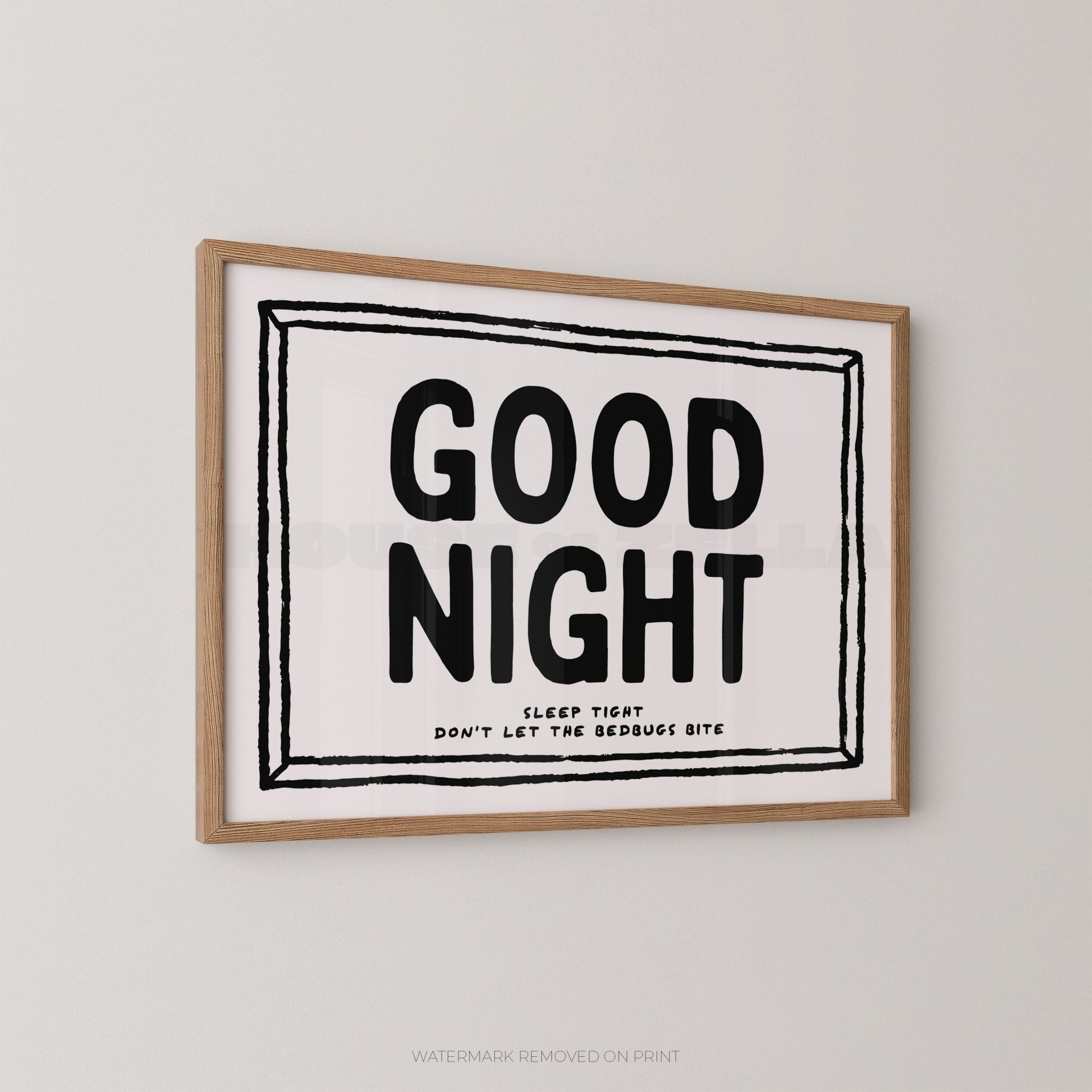 Framed print with 'Good Night' text on a plain wall