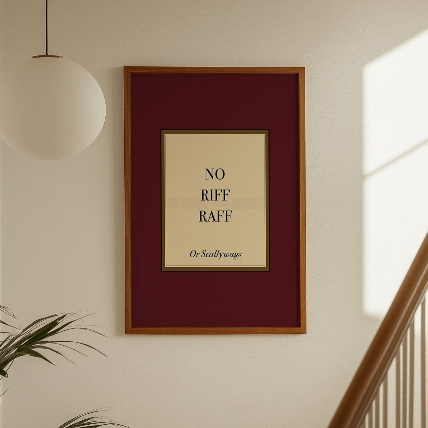 Framed artwork with text on a wall above a staircase