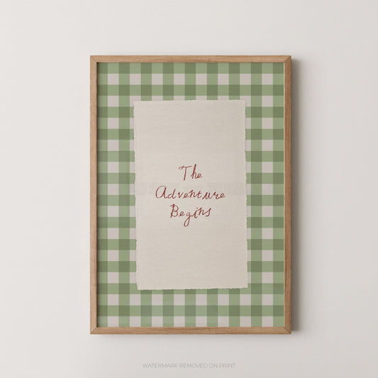 Framed print with 'The Adventure Begins' text on a green and white checkered background