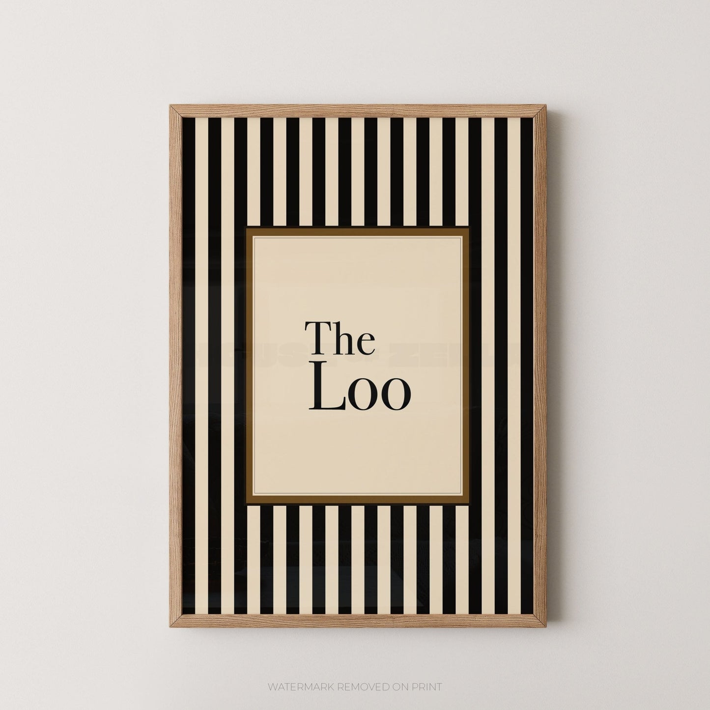 Framed artwork with black and white striped border and 'The Loo' text on a beige background
