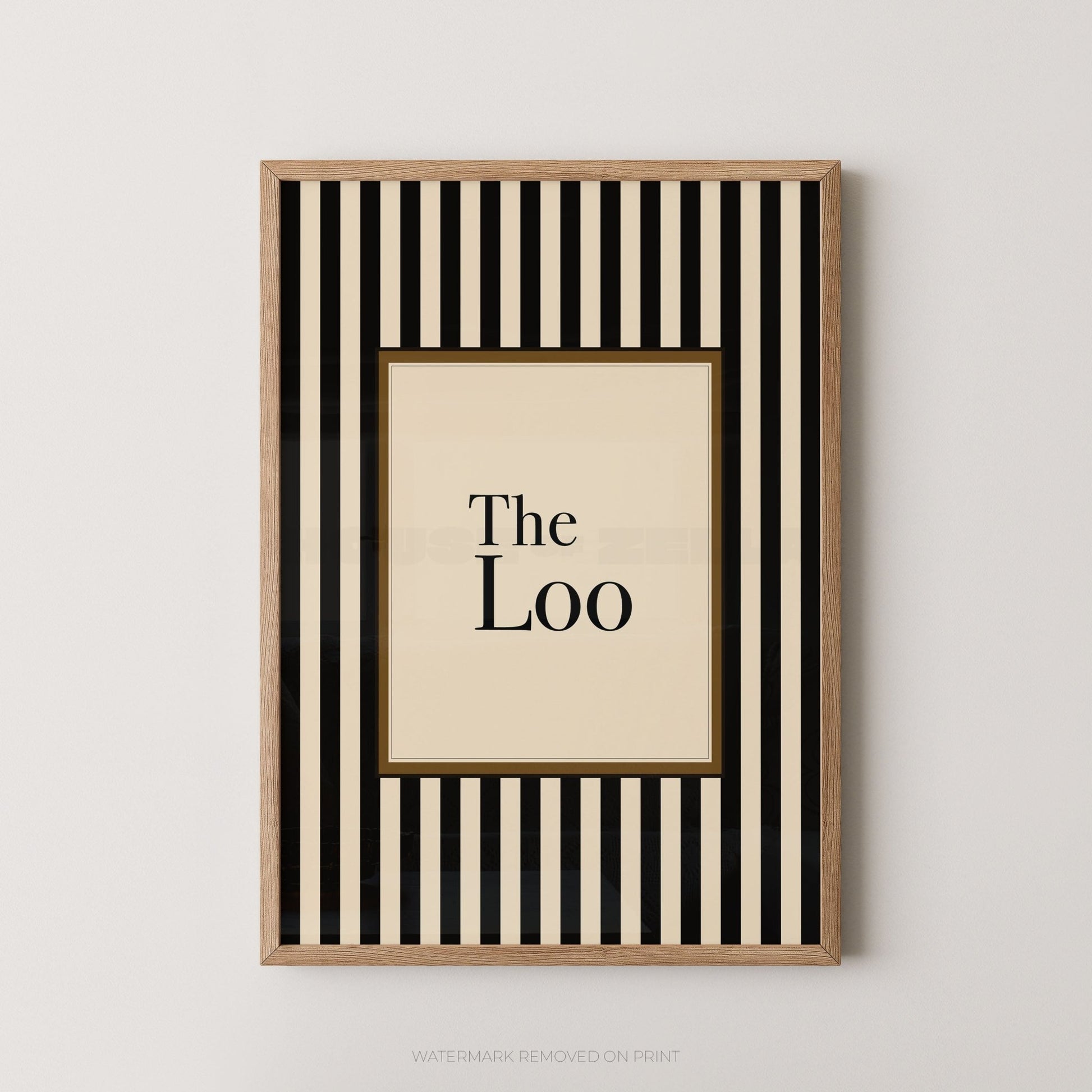 Framed artwork with black and white striped border and 'The Loo' text on a beige background