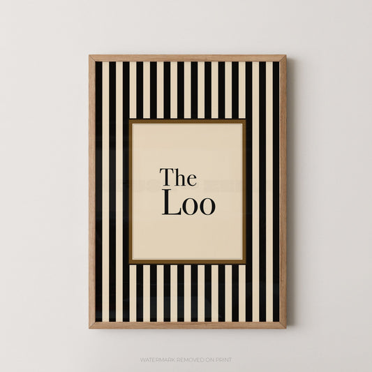 Framed artwork with black and white striped border and 'The Loo' text on a beige background