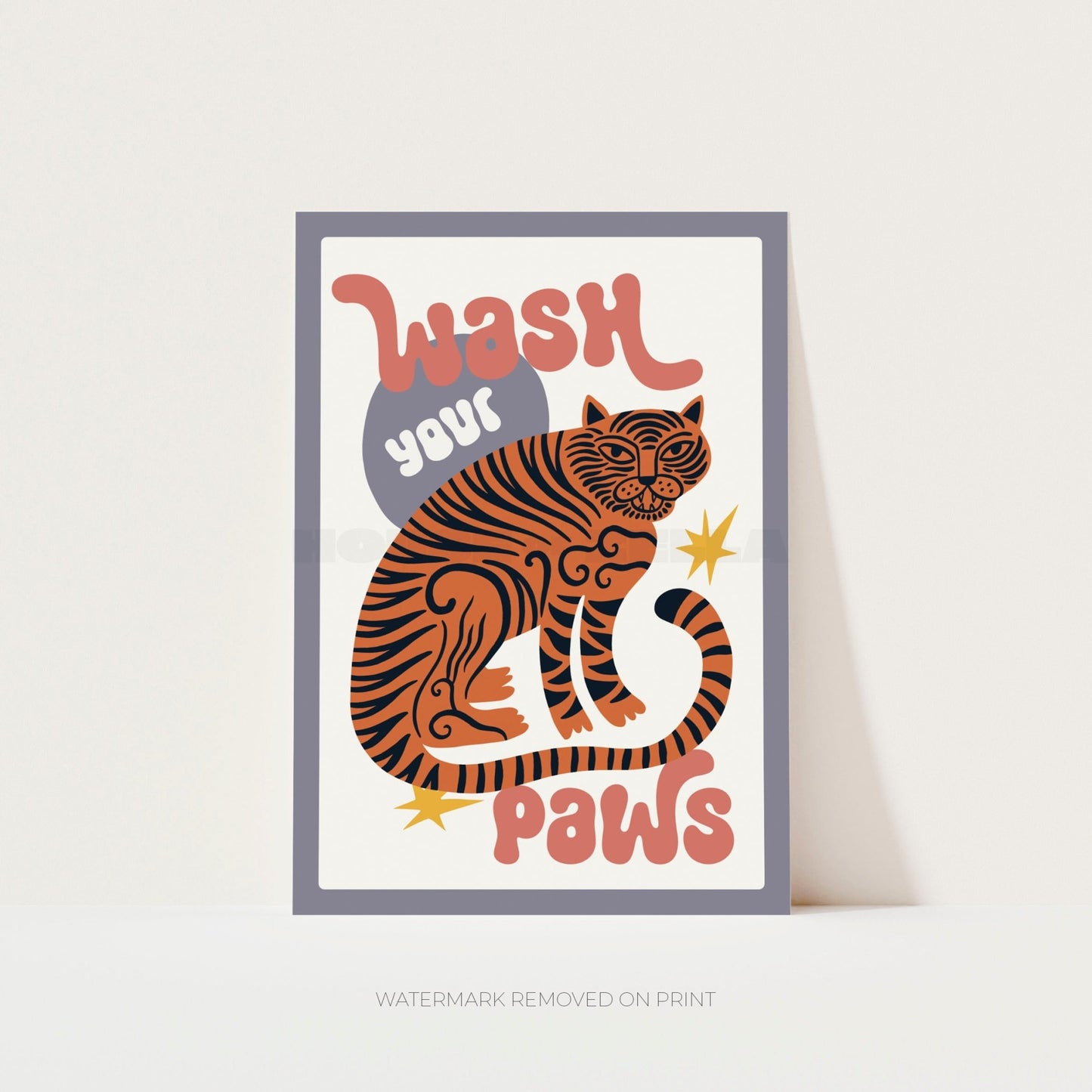 Framed artwork with a tiger illustration and text 'Wash your paws' on a light background