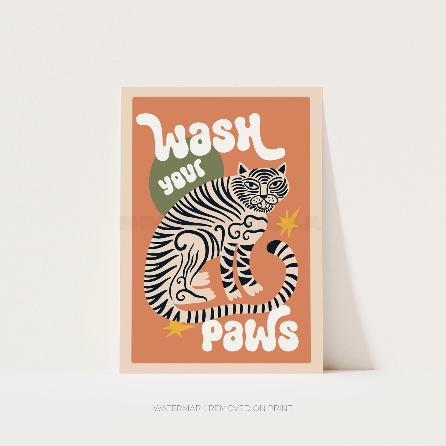 Framed artwork with a tiger illustration and text 'Wash your paws' on a peach background.